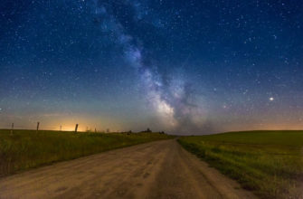 the milky way rises over a dirt road in Kamloops, British Columbia