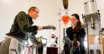 Carboniste winemakers bottling sparkling red wine