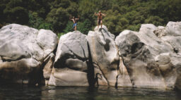 Two Boys Jump from Boulders at the Yuba River
